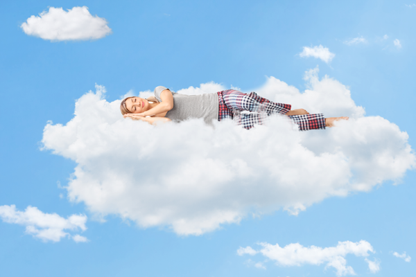 Woman floating on a cloud